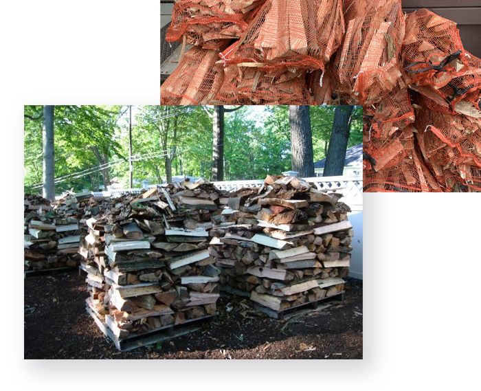 Firewood stacked on pallets outdoors, also mesh bags of firewood in the background.
