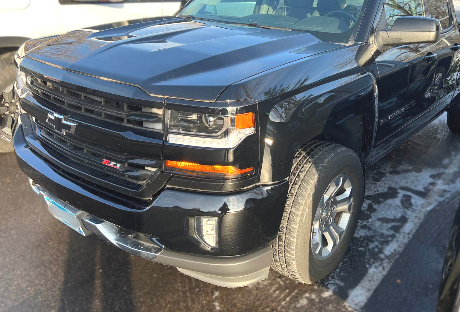 Vehicle with front end damage after repairs were performed by Modern Auto Body.