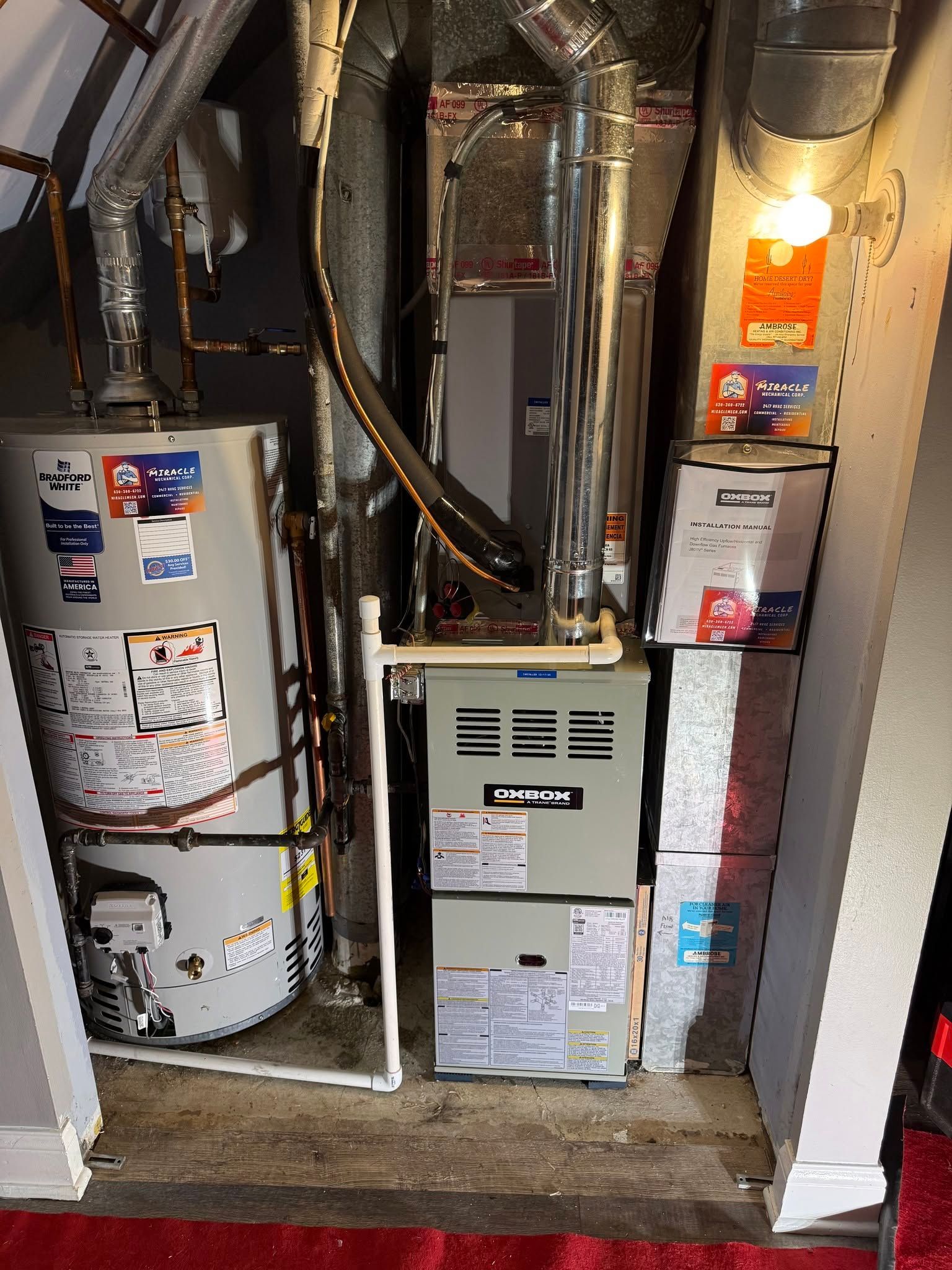 Basement furnace and water heater with exposed ductwork and utility labels in a small mechanical room