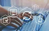 Hands typing on laptop with digital security and cloud icons overlayed on screen