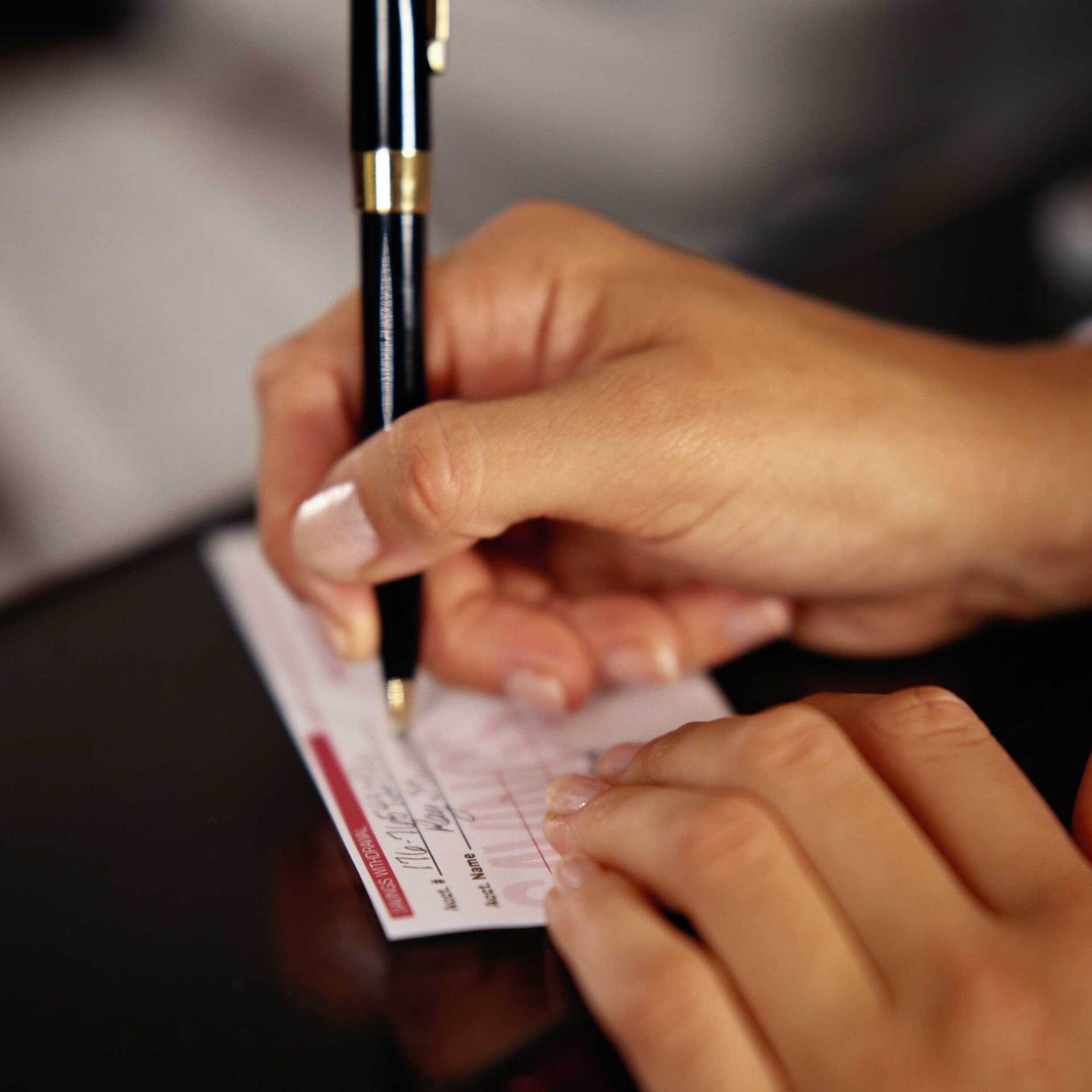 Filling Out A Deposit Slip — Tarboro, NC — Tarboro Savings Bank