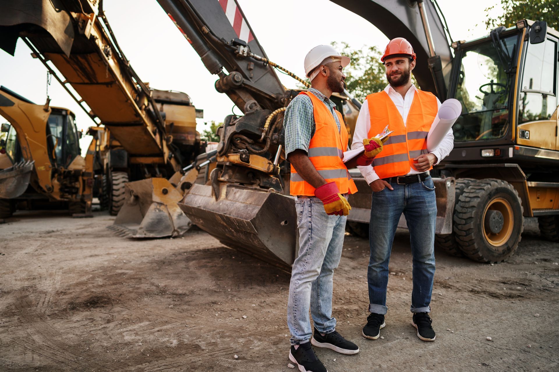 Heavy Equipments Behind The Two Guys — Honolulu, HI — David Yamada, LLC