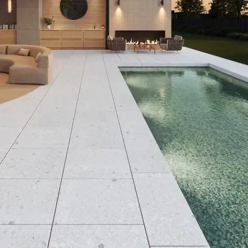 A living room with a fireplace and a swimming pool