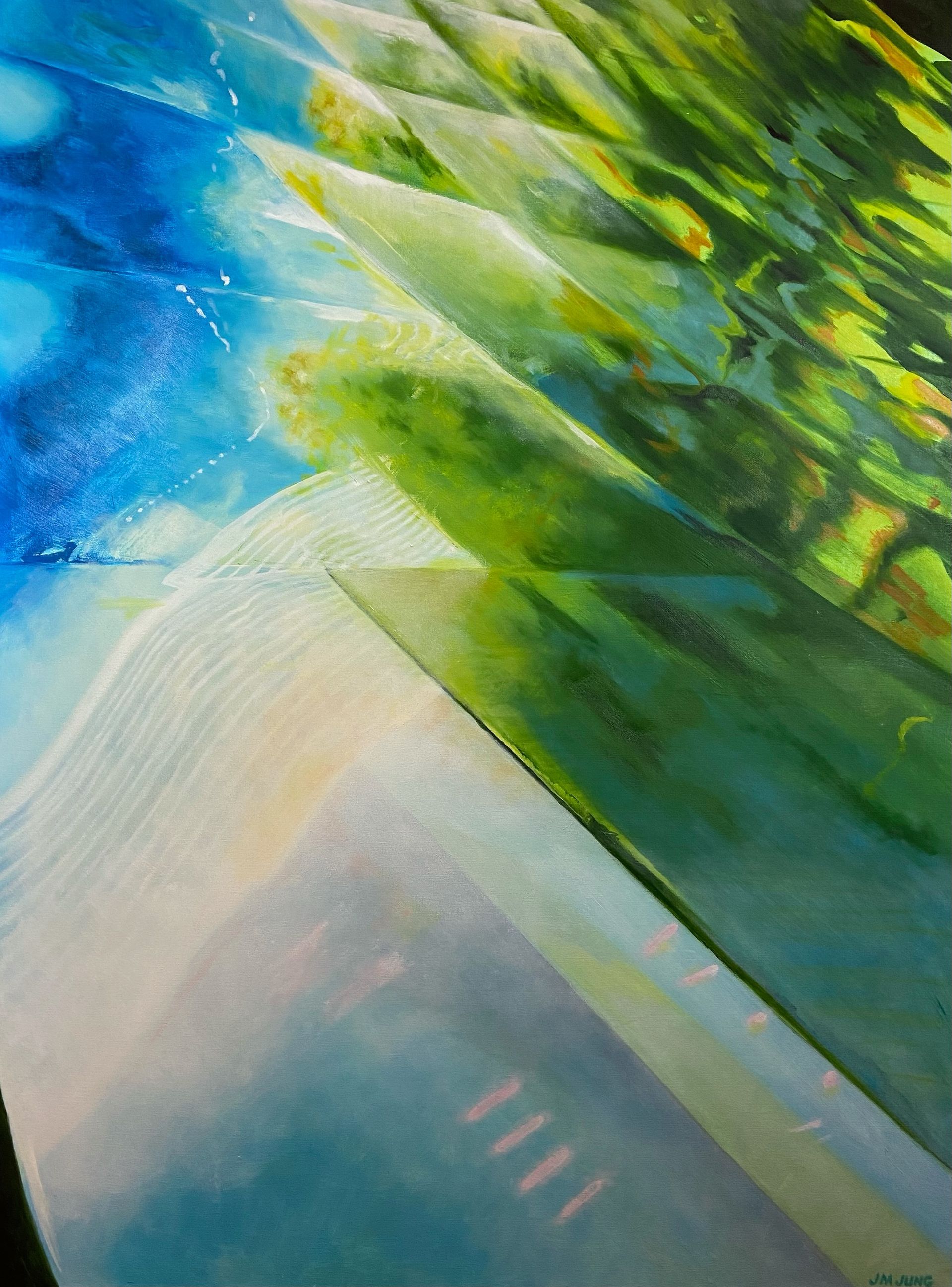 A close-up of a metal bridge, with the reflections of green trees and blue sky on a September day in Chicago.