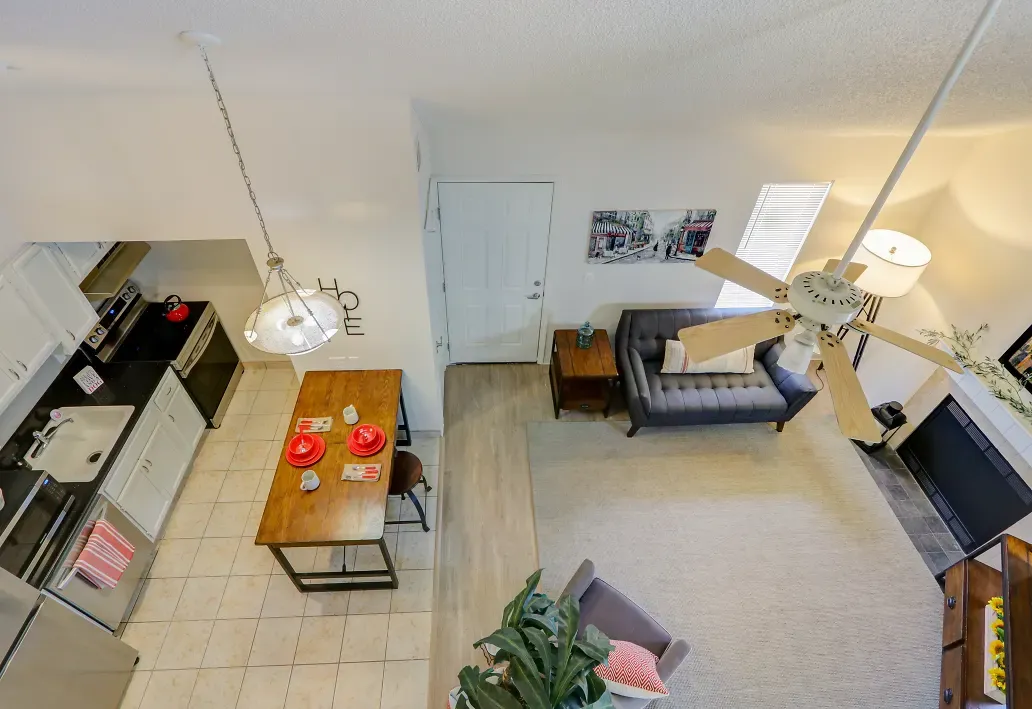 Aerial view of living room with doorway to front yard