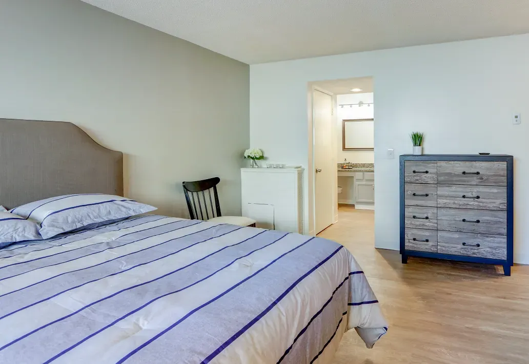 Interior of bedroom with view into bathroom