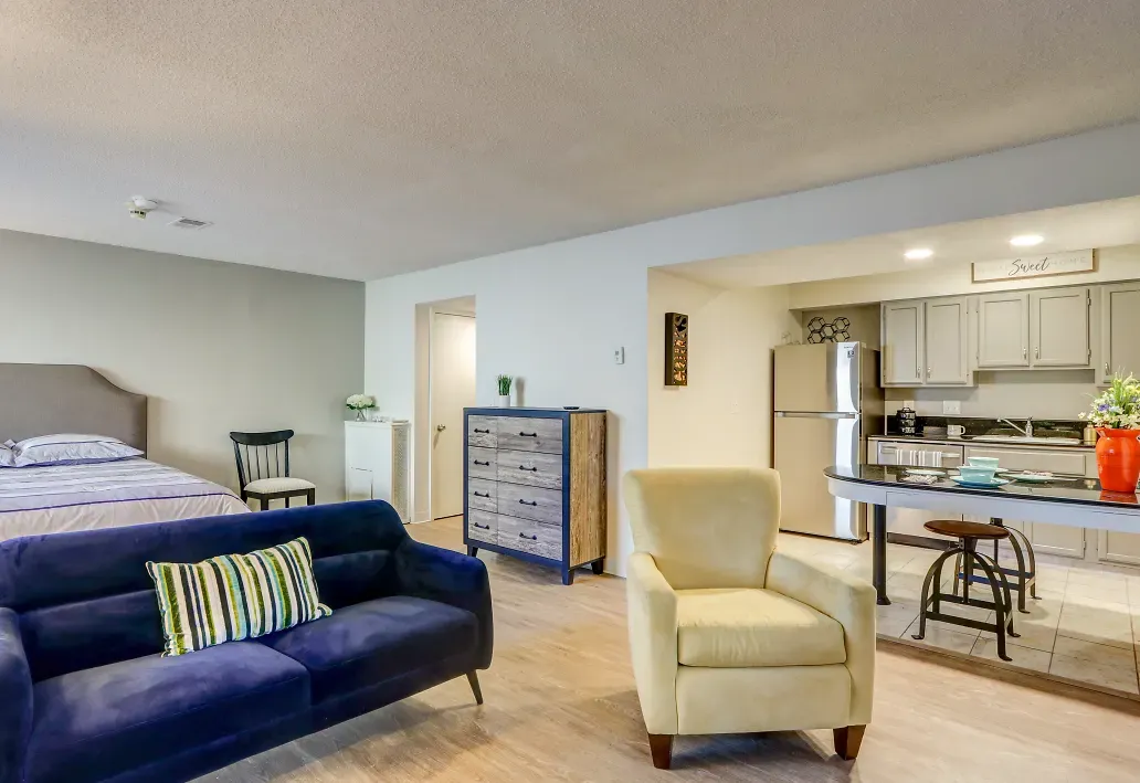 Interior of living room viewing into the kitchen