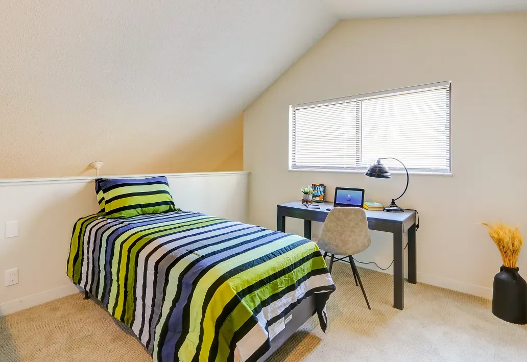 Interior of bedroom with large window