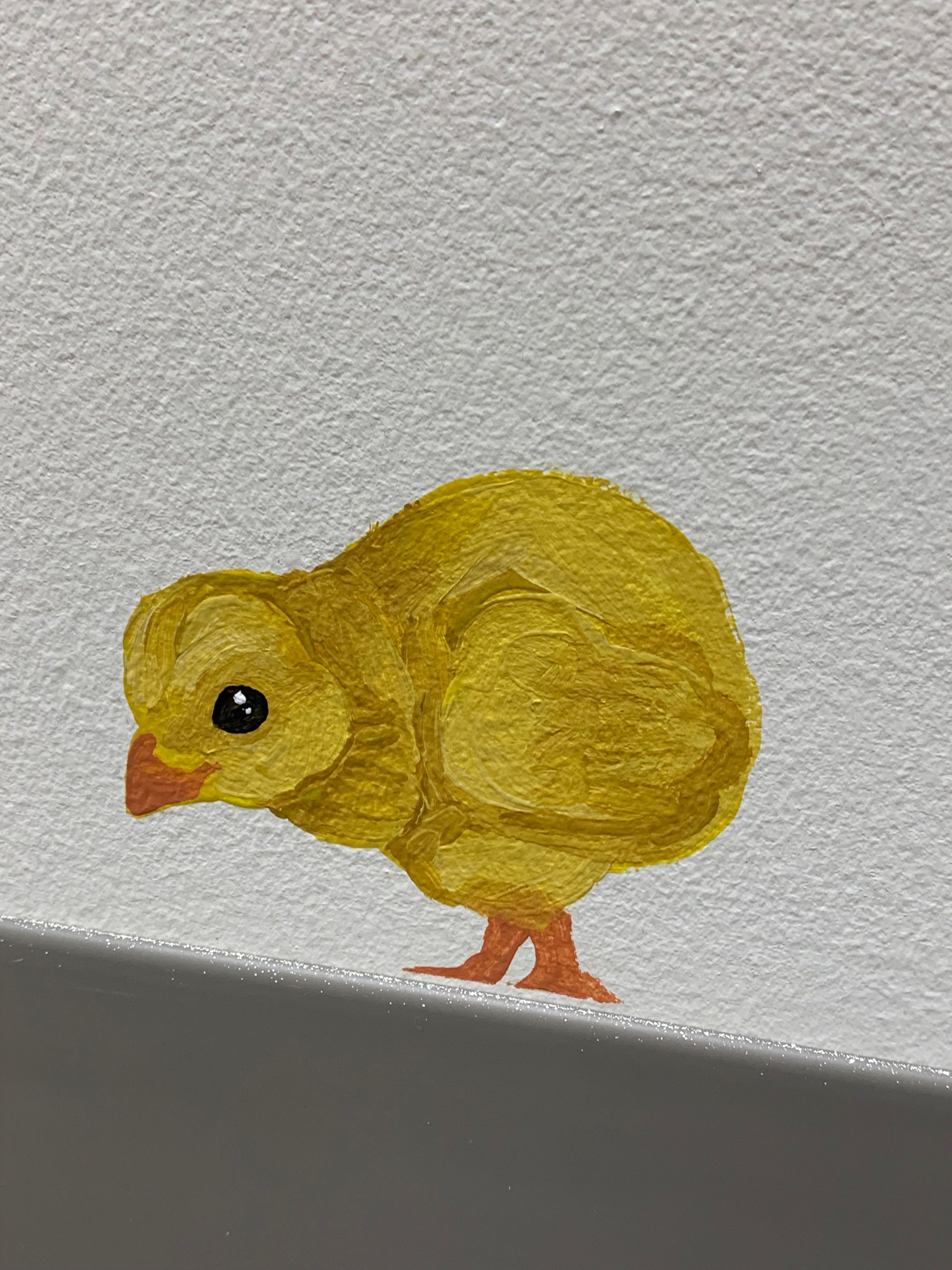 A painting of a yellow chick at at Advocare Fairmount Pediatrics