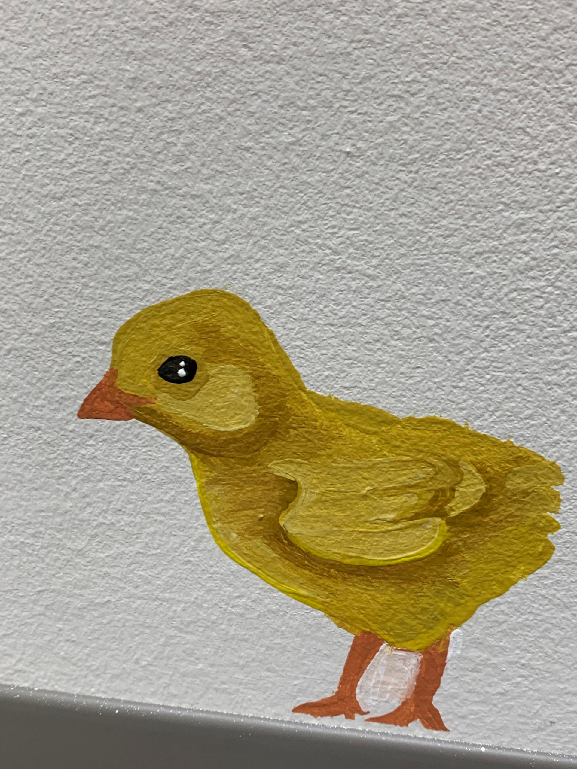 A painting of a yellow chick at at Advocare Fairmount Pediatrics