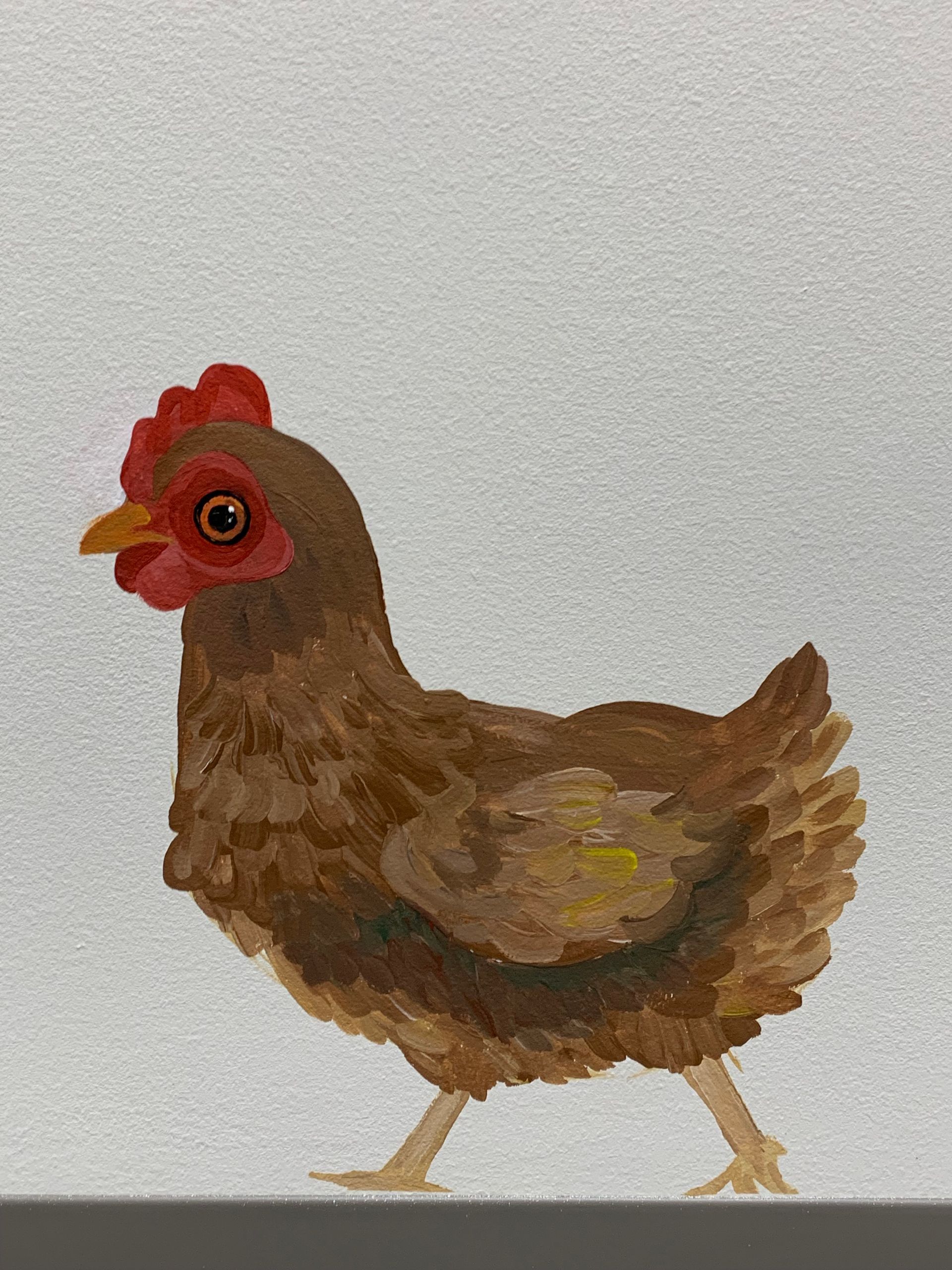 A painting of a brown chicken with a red crest at Advocare Fairmount Pediatrics