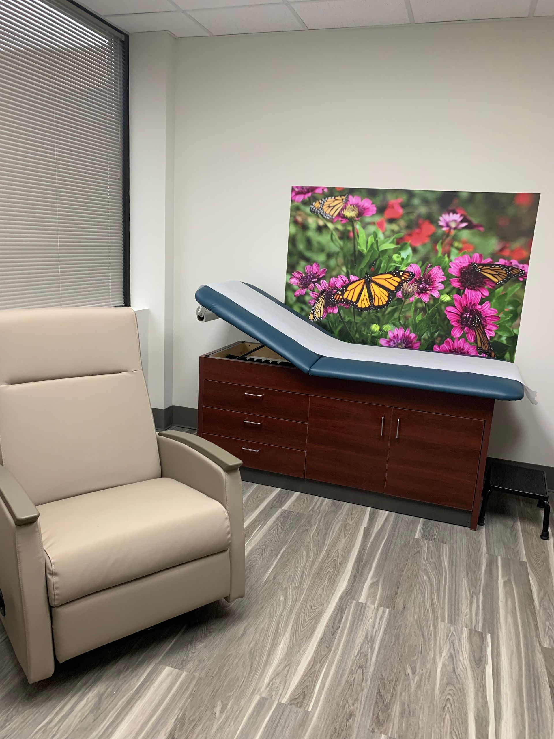 A chair and a table in the room at at Advocare Fairmount Pediatrics