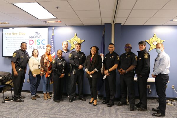 Kai with the officers at sheriff's office