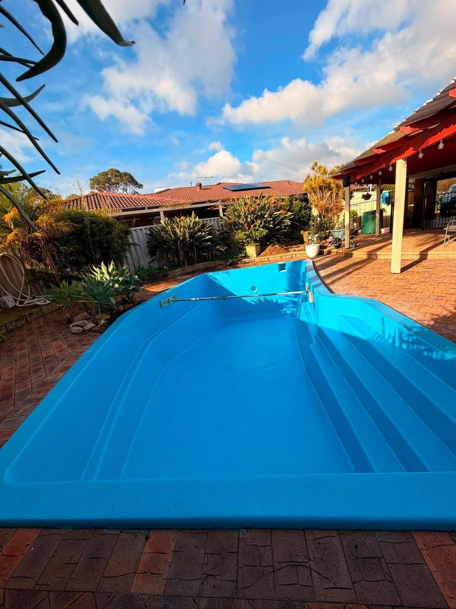 After image of a swimming pool which requires resurfacing.