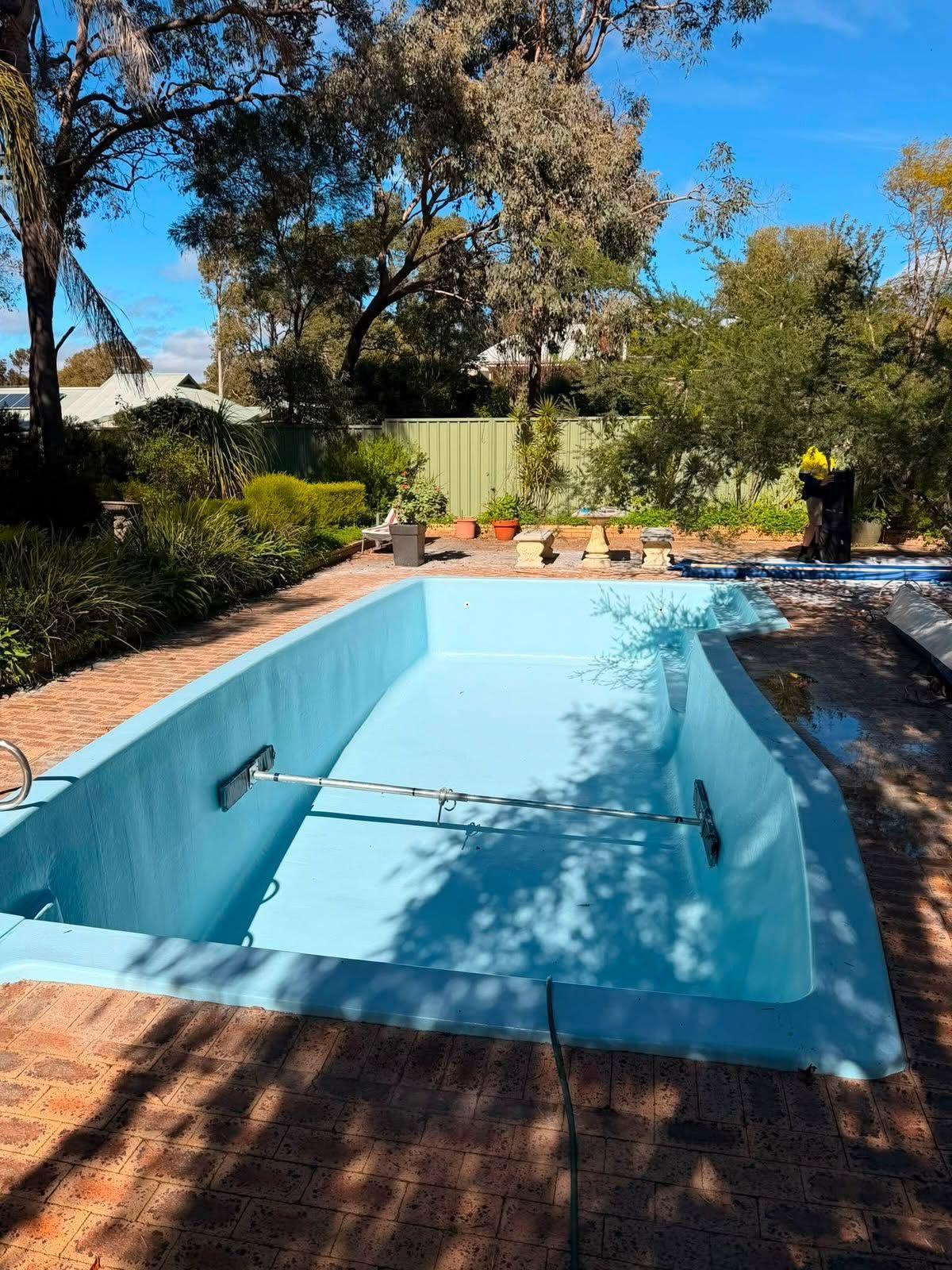 After image of a swimming pool which requires resurfacing.