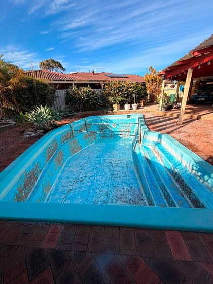 During image of a swimming pool which requires resurfacing.