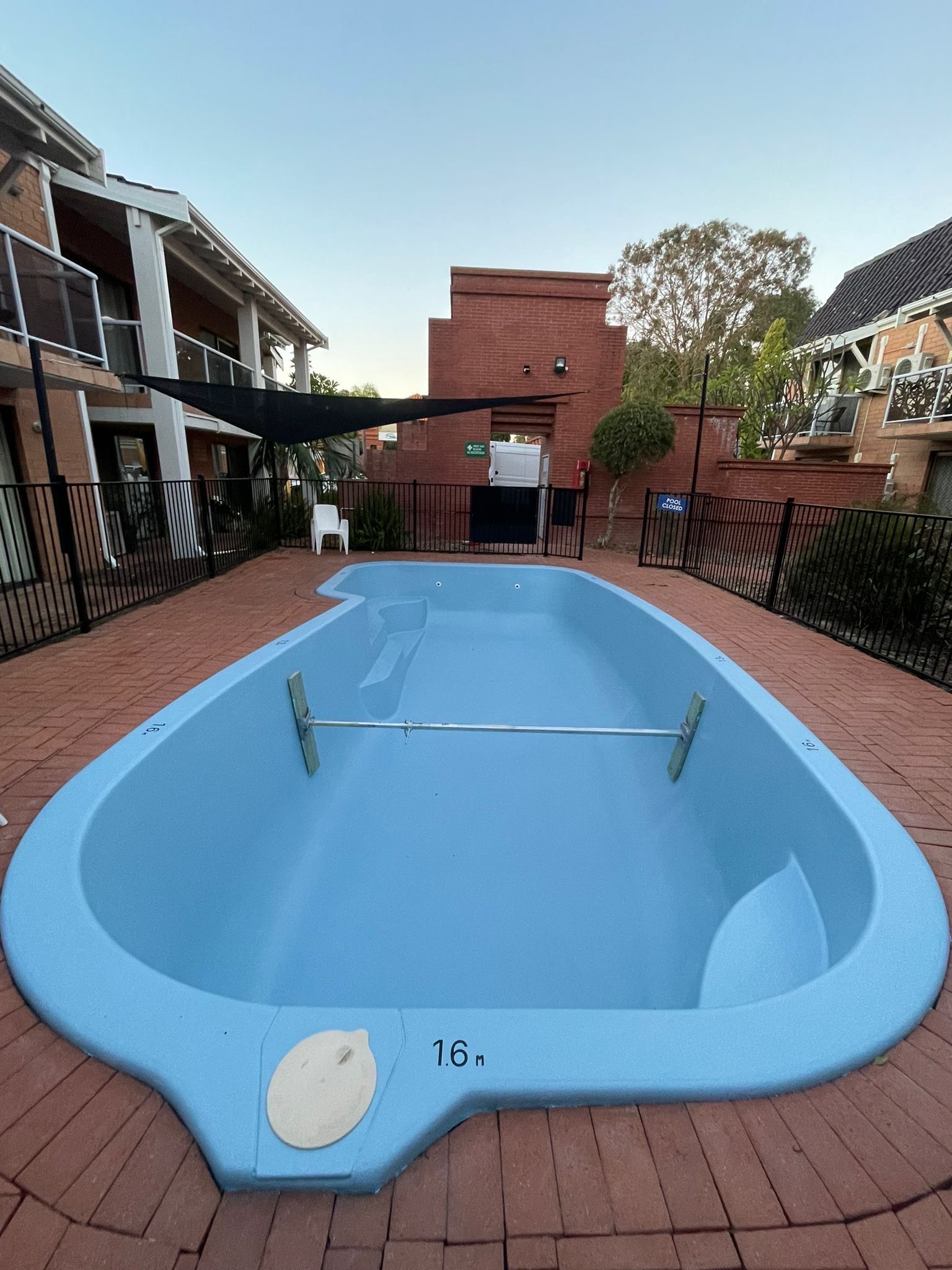 After image of a swimming pool which requires resurfacing.