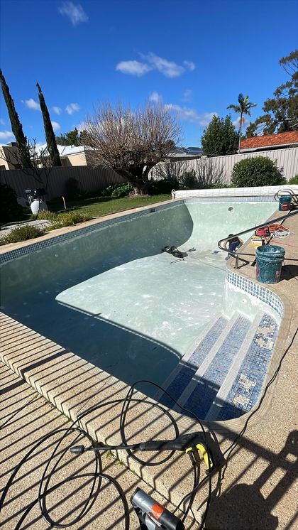 Before image of a swimming pool which requires resurfacing.