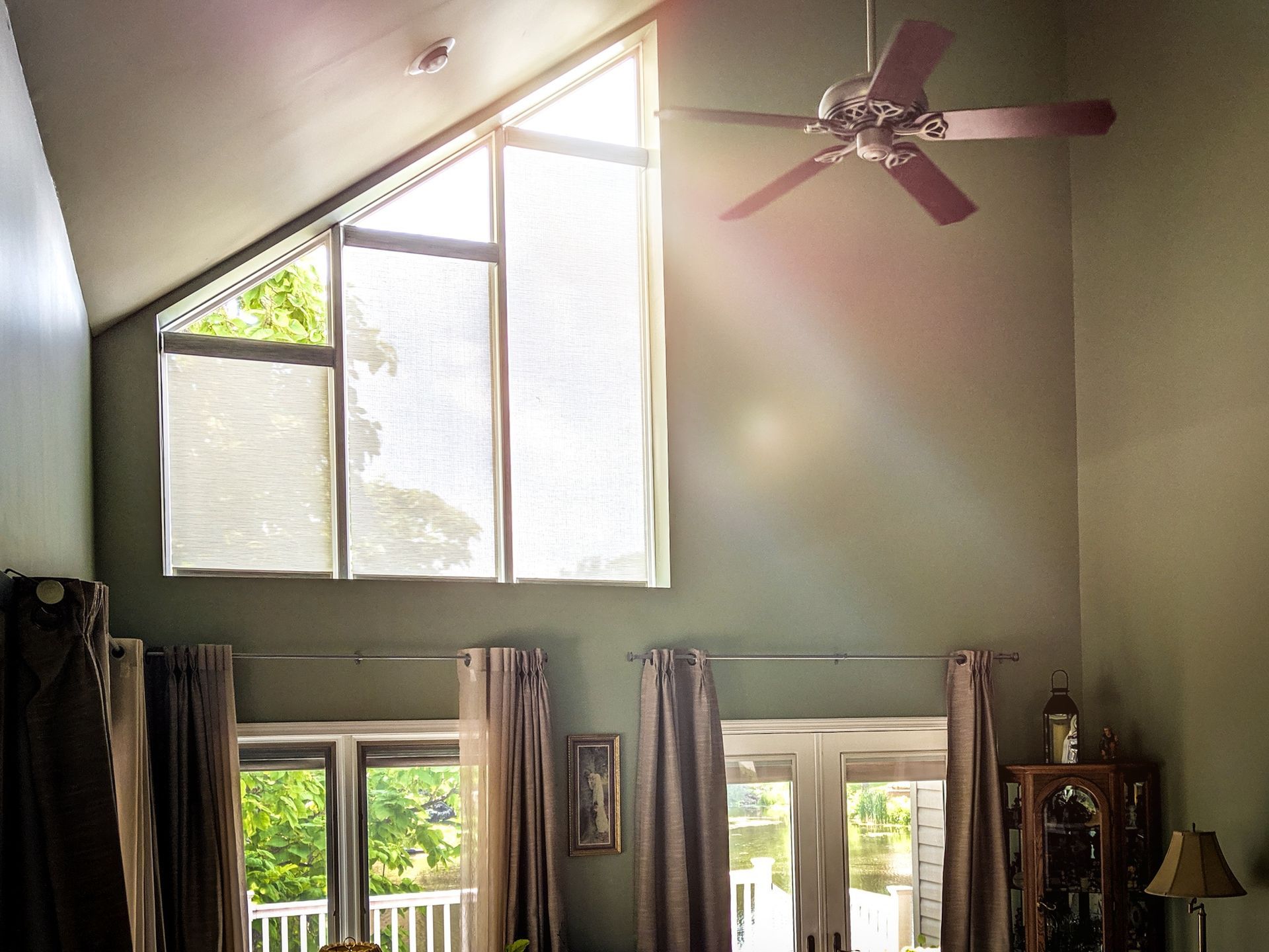 Solar Shield Roller Shade installed on angle toped windows in a great room