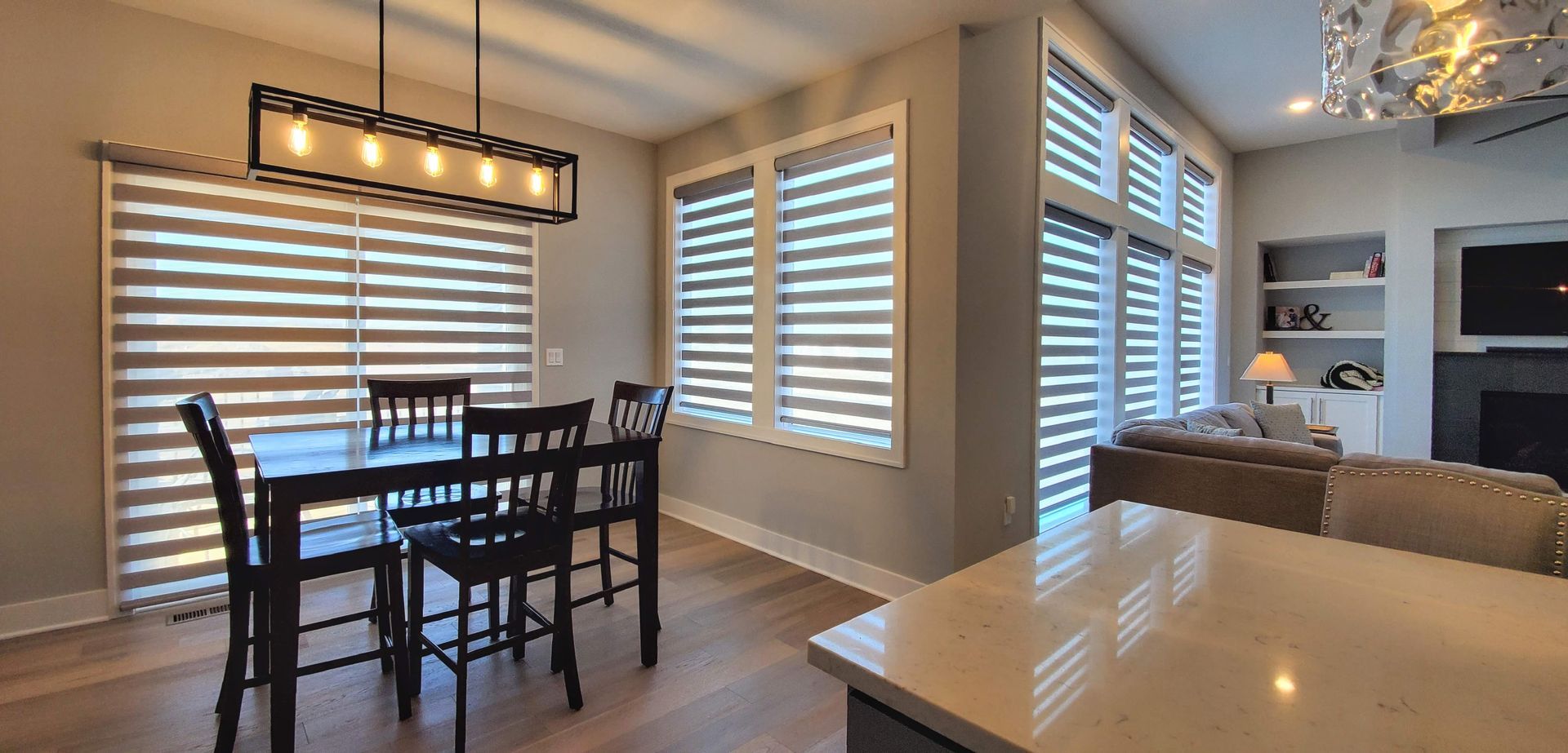 Banded shades by Solar Shield installed in a dining room in Kansas City