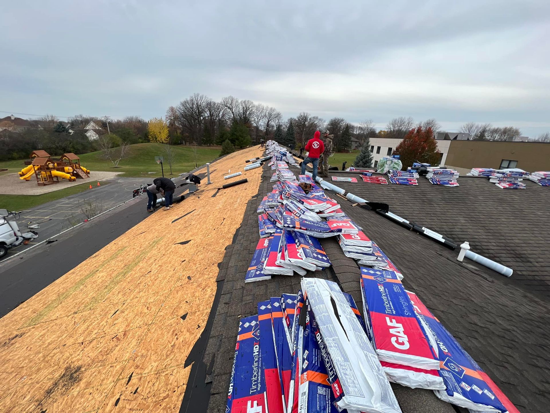 A close up of a roof with a lot of shingles on it.