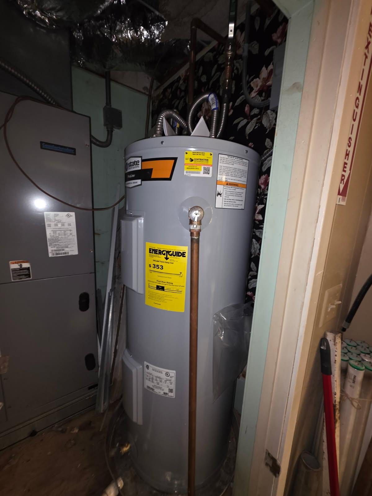 A water heater and HVAC unit in a utility room. Gray tank with yellow energy label, copper pipe.
