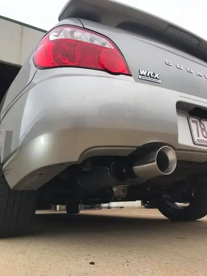 A Silver Car With a License Plate That Says 713 is Parked in a Parking Lot — Ace Exhaust Centre in Berserker, QLD