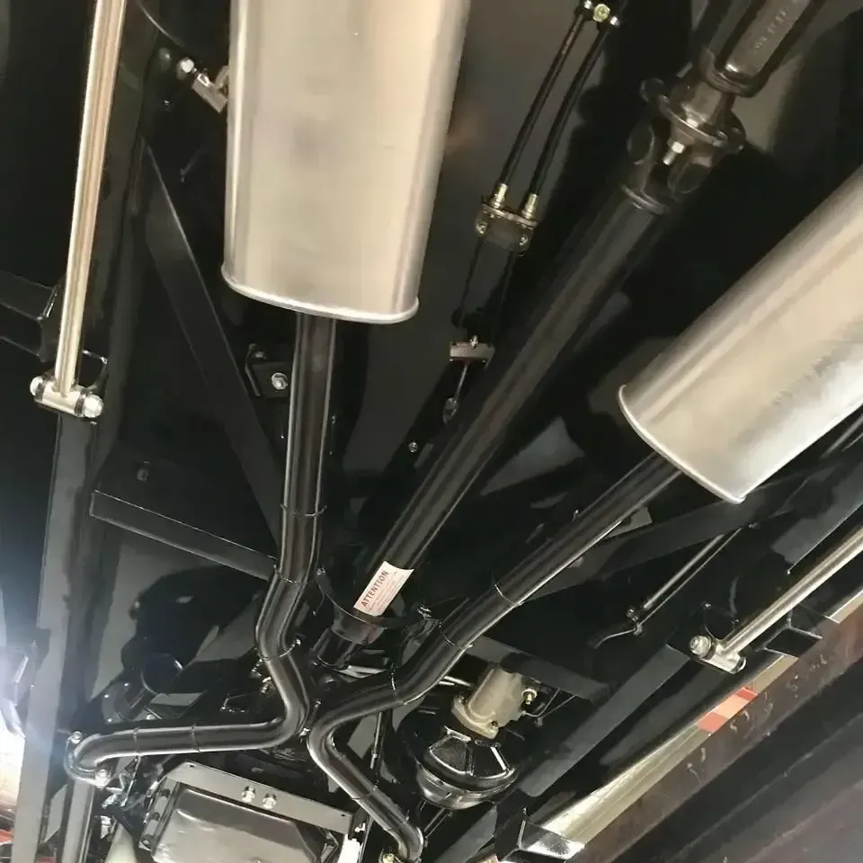 A Close Up of the Underside of a Car With Exhaust Pipes — Ace Exhaust Centre in Berserker, QLD