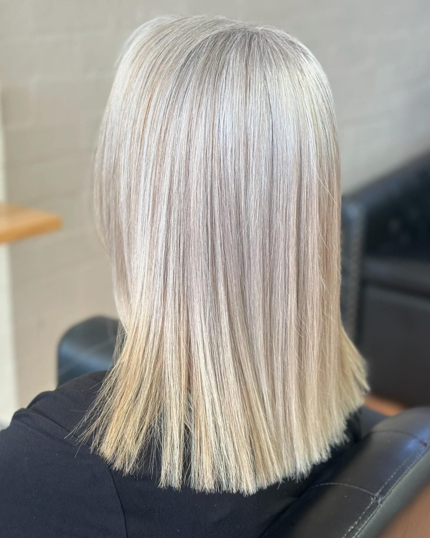 Smiling Person With Wavy Blonde Hair Featuring Vibrant Pink and Purple Ombre Ends — Devyani Hair & Beauty in Unanderra, NSW