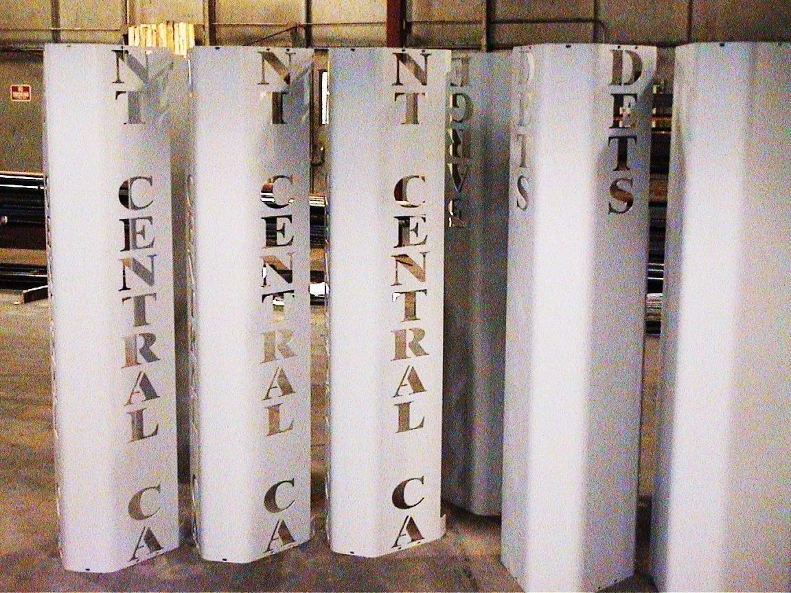 White binders lined up on a shelf, labeled “Central C” and “Tests” in vertical black text