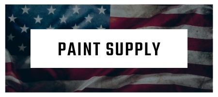 A picture of an american flag with a sign that says paint supply.