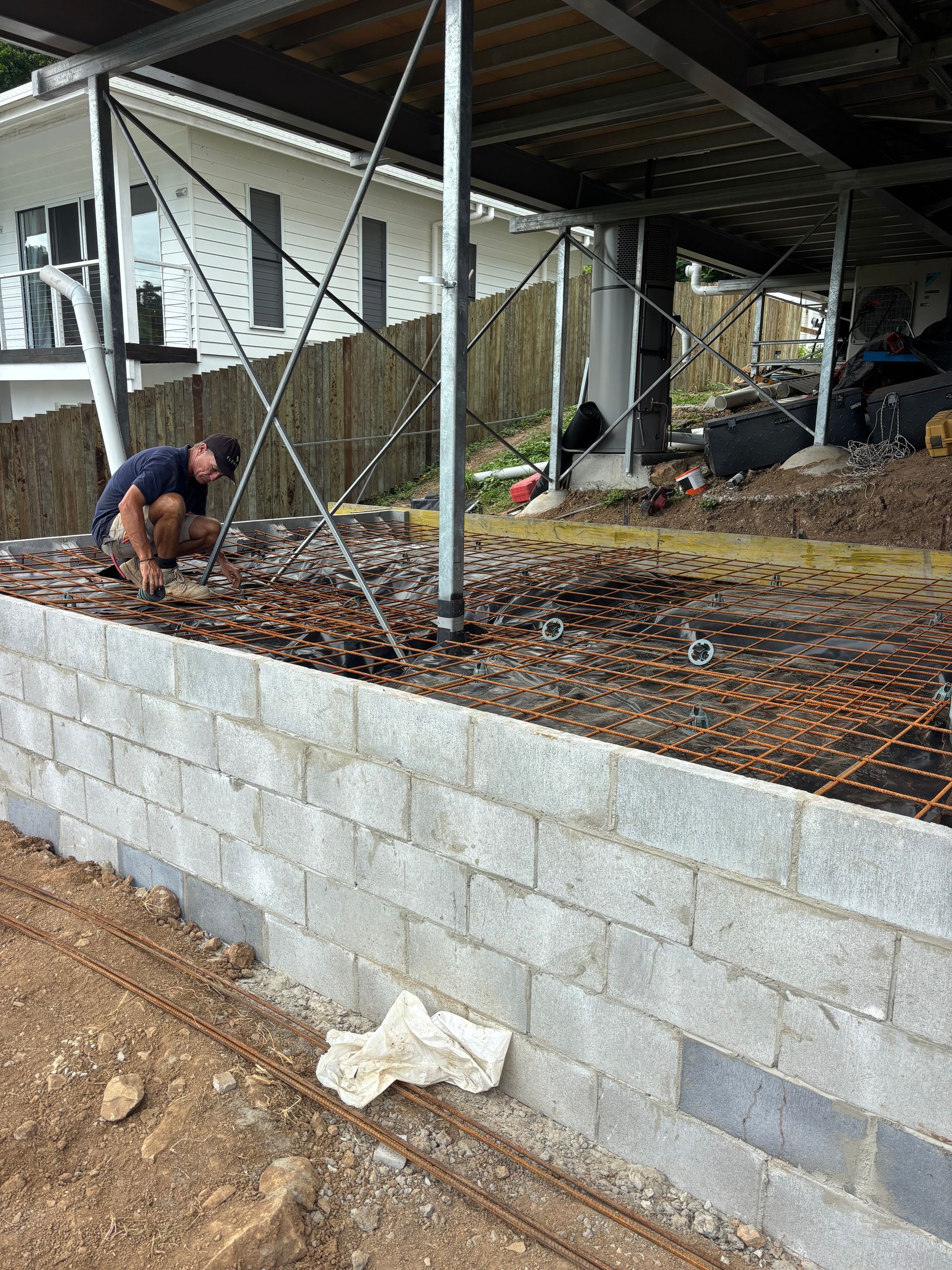 A House Is Being Built On A Concrete Foundation — Tuscany Concreting In Whitsundays, QLD