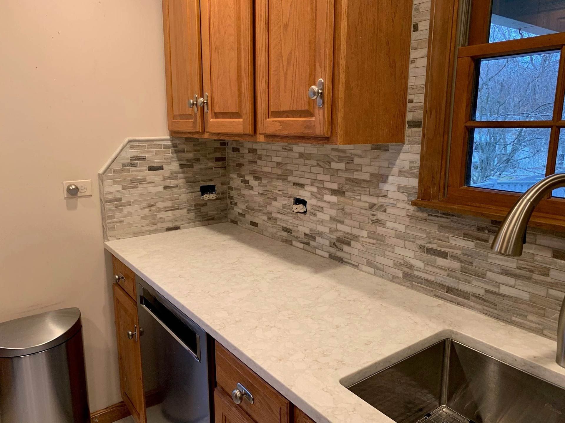 Kitchen with wooden cabinets and backsplash