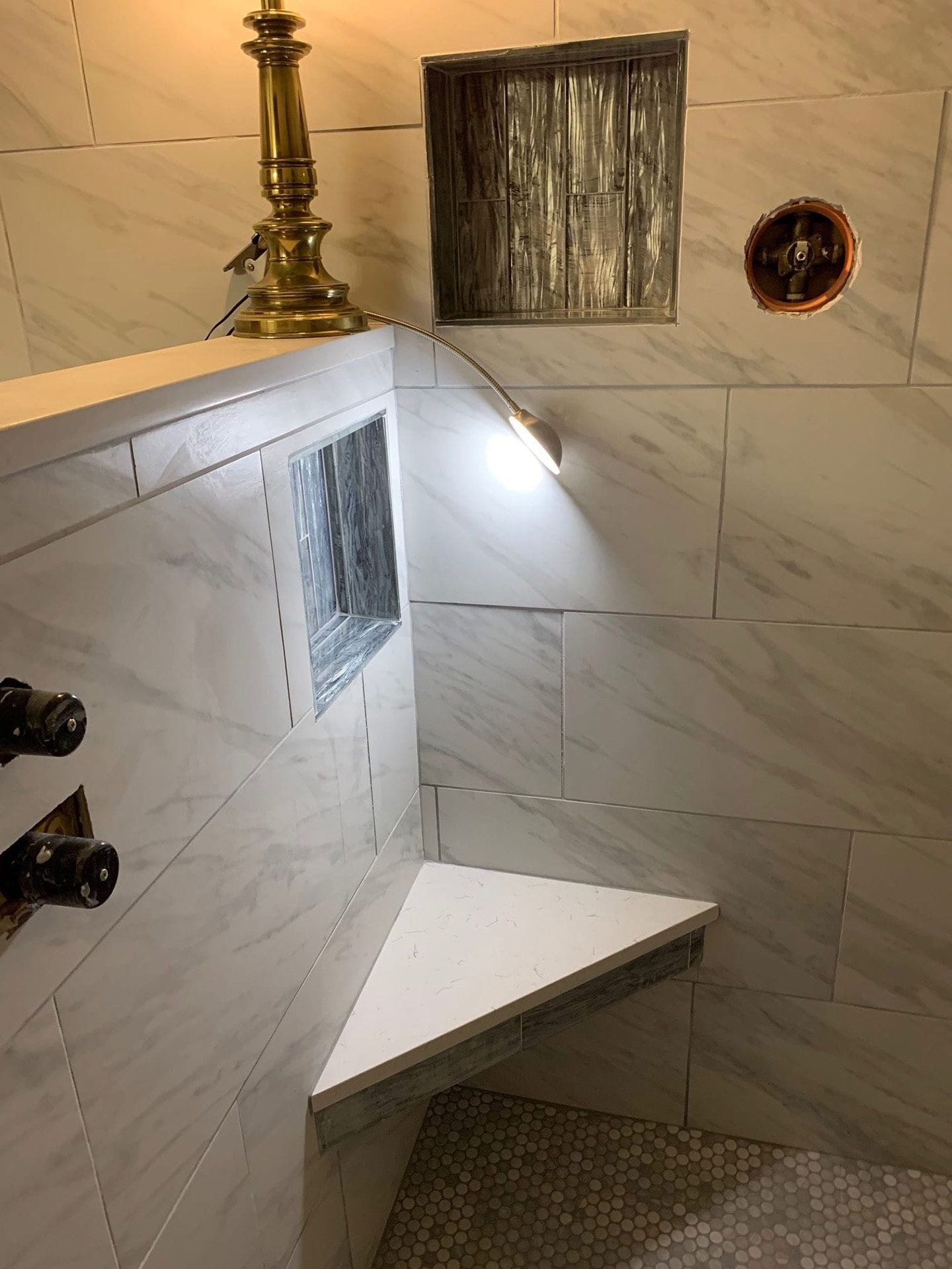 Bathroom with marble tile wall