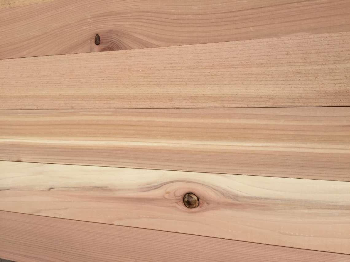 Light-colored wooden planks with visible grain and knots
