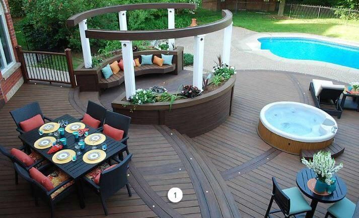 Backyard deck with dining table, lounge chairs, hot tub, and pool view