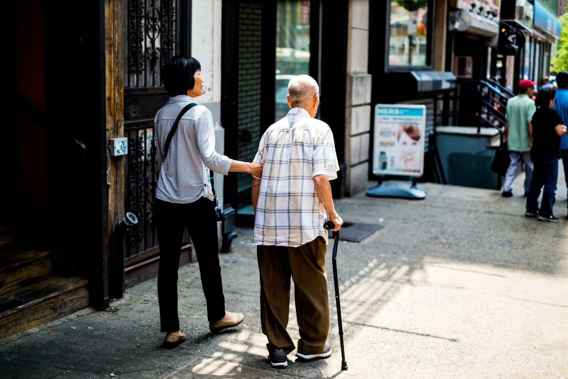 Caregiver walking with man