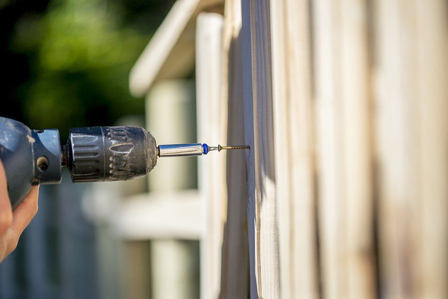 someone screwing the fence