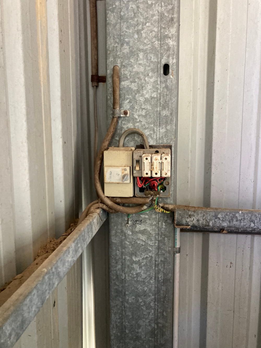 A Close Up Of A Electrical Box On The Side Of A Building — AA Electrical Co in Yeppoon, QLD