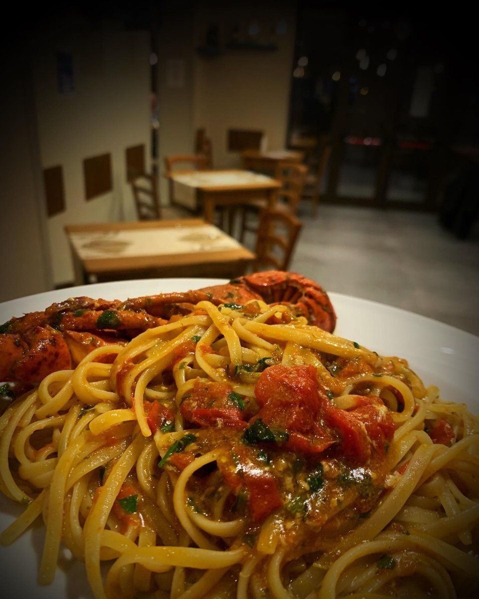 spaghetti con pomodoro e polpo