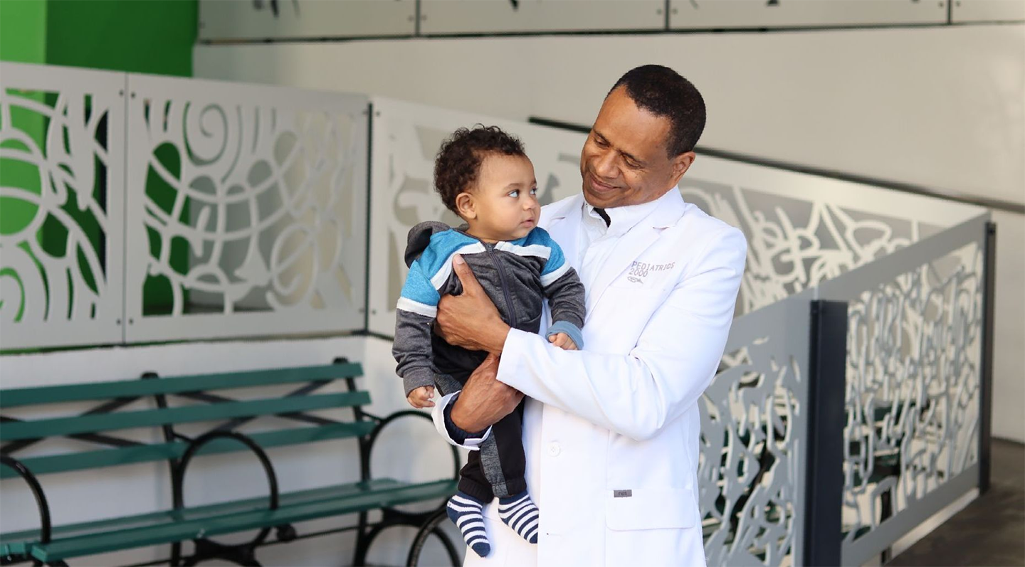 Doctor holding child