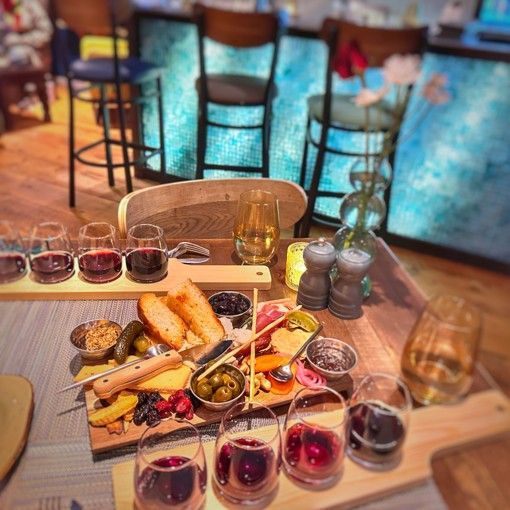 Wine tasting flights served with a curated charcuterie board at Chloe's Charcuterie & Wine
