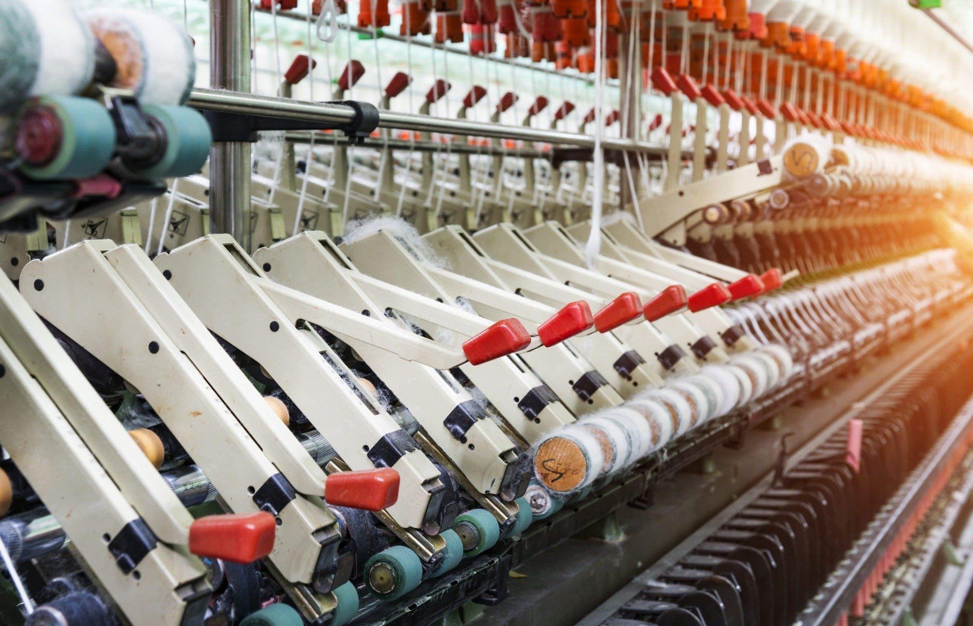 A machine is spinning yarn in a factory.