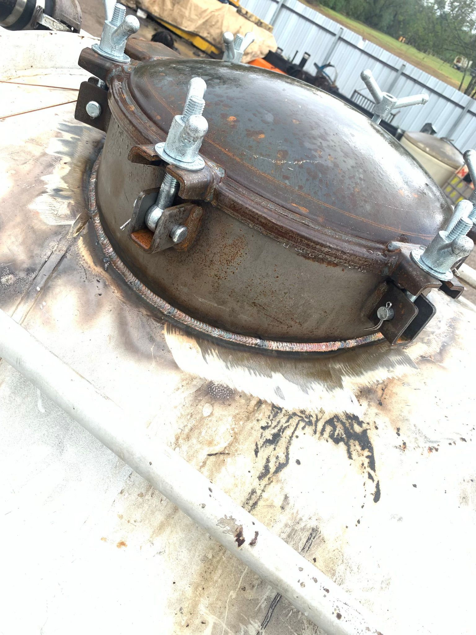 A close up of a metal object with a lid on top of it.
