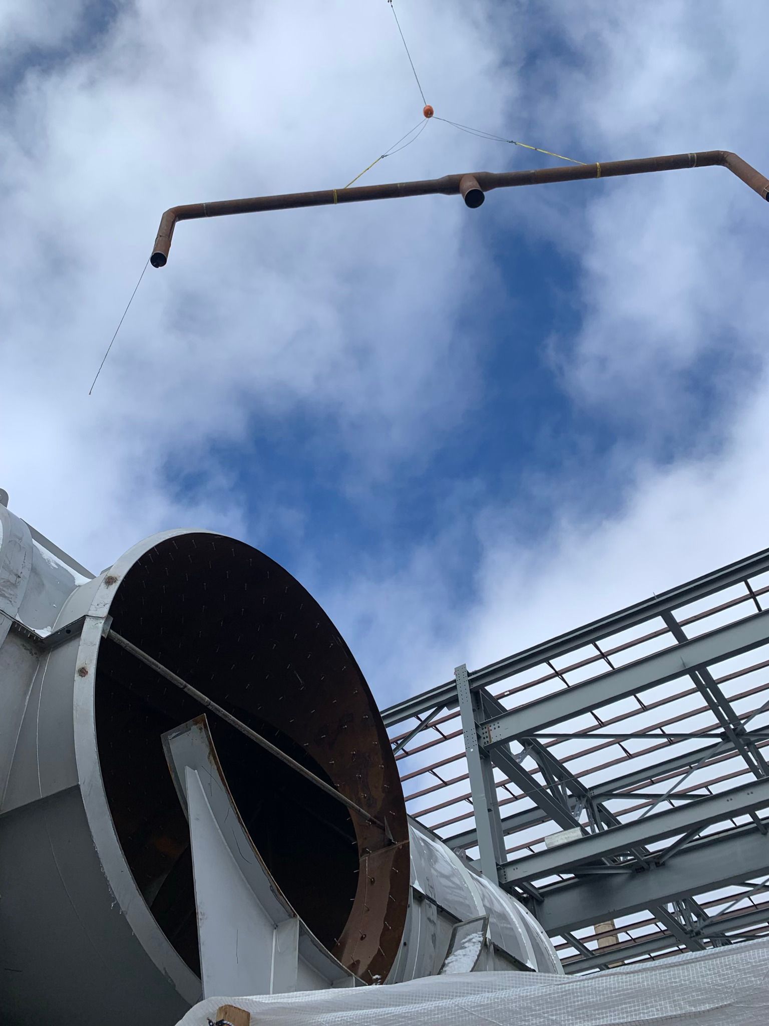 A large pipe with a blue sky in the background