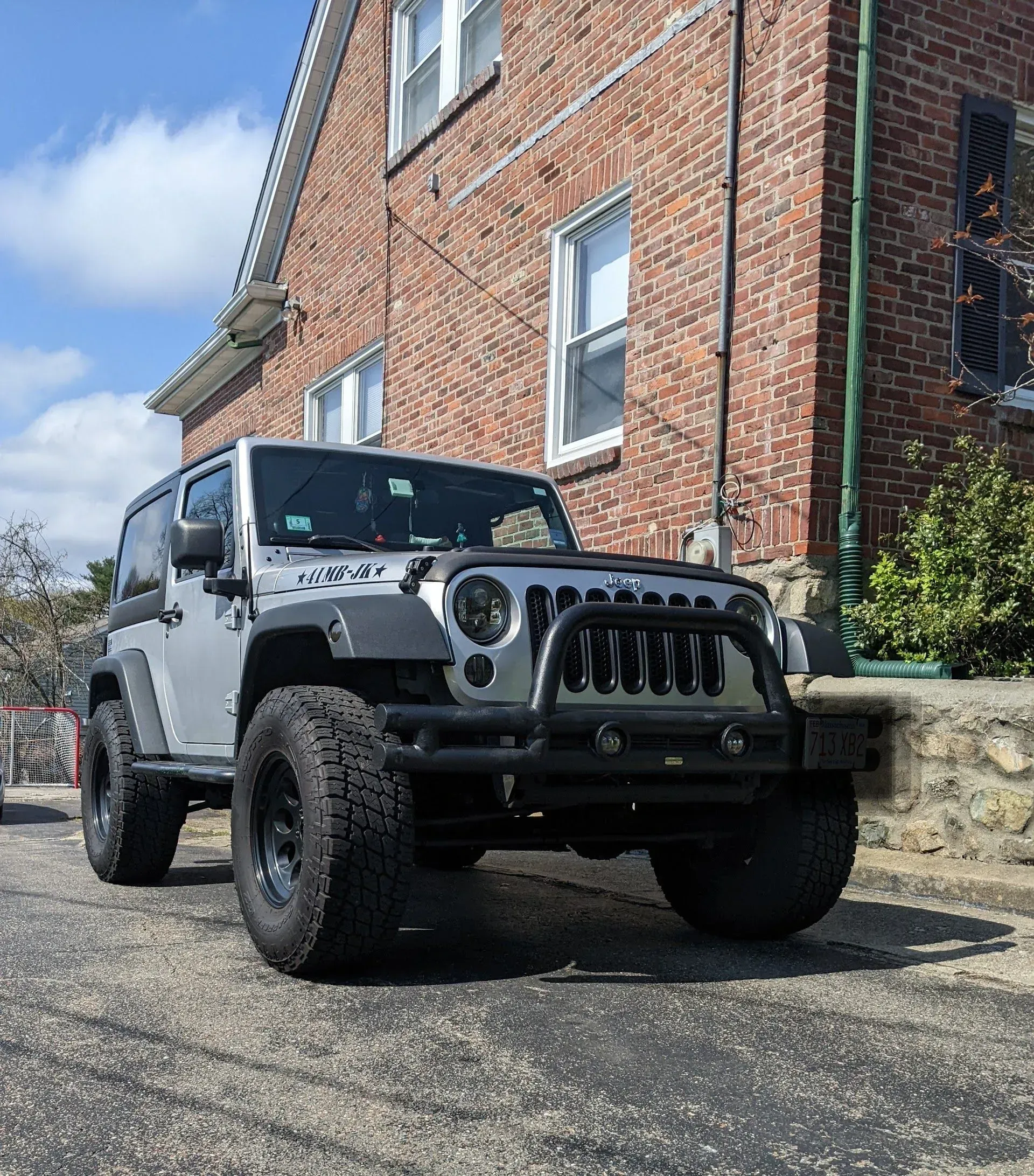 Gray Jeep Wrangler Parked Outside The Auto Shop | Express Tire & Auto Service