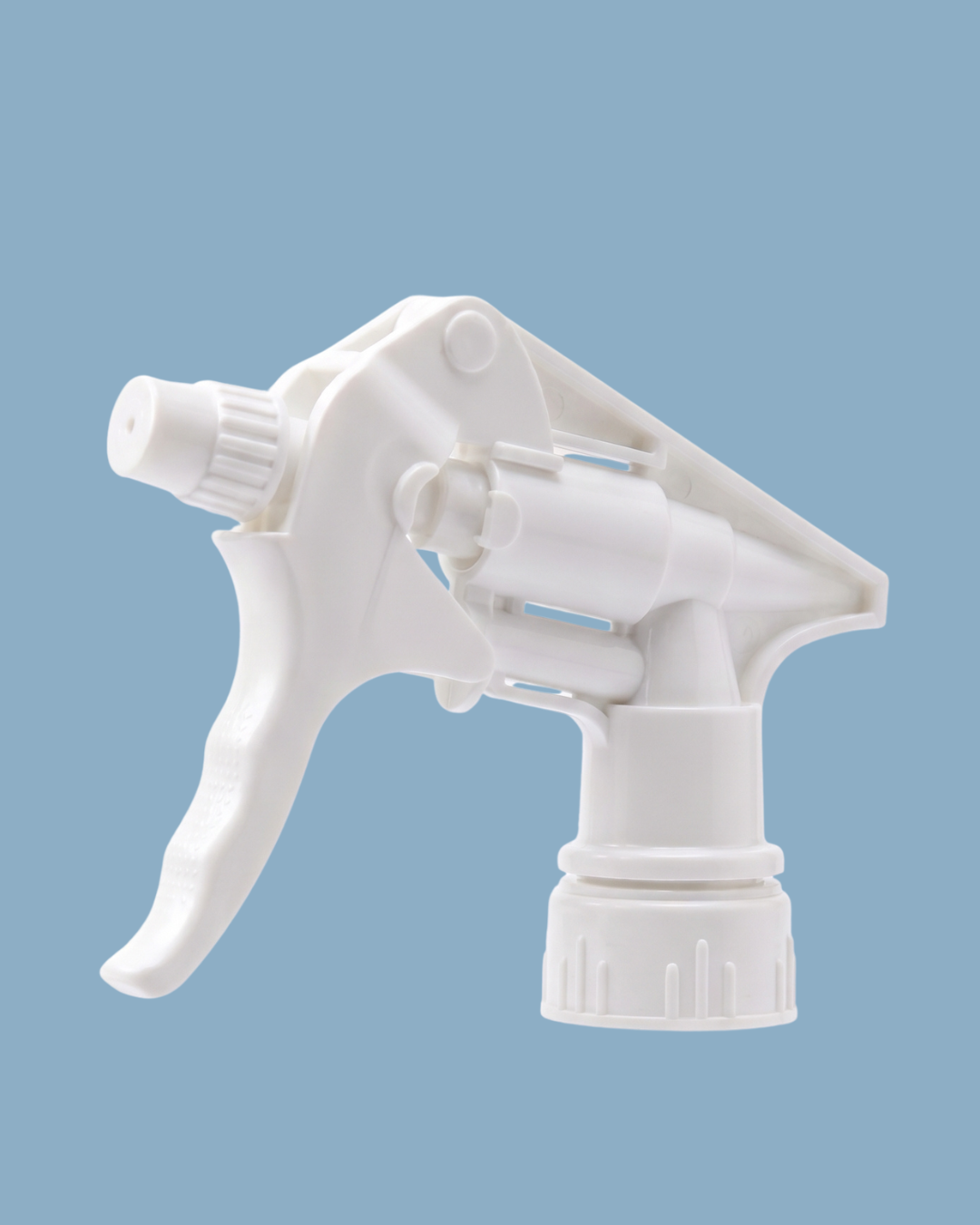 White plastic spray bottle nozzle on a blue background