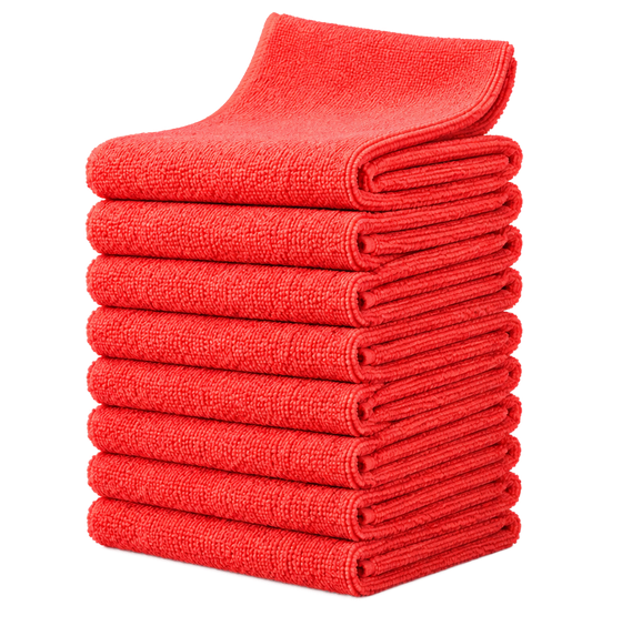 Stack of folded red towels on a white background