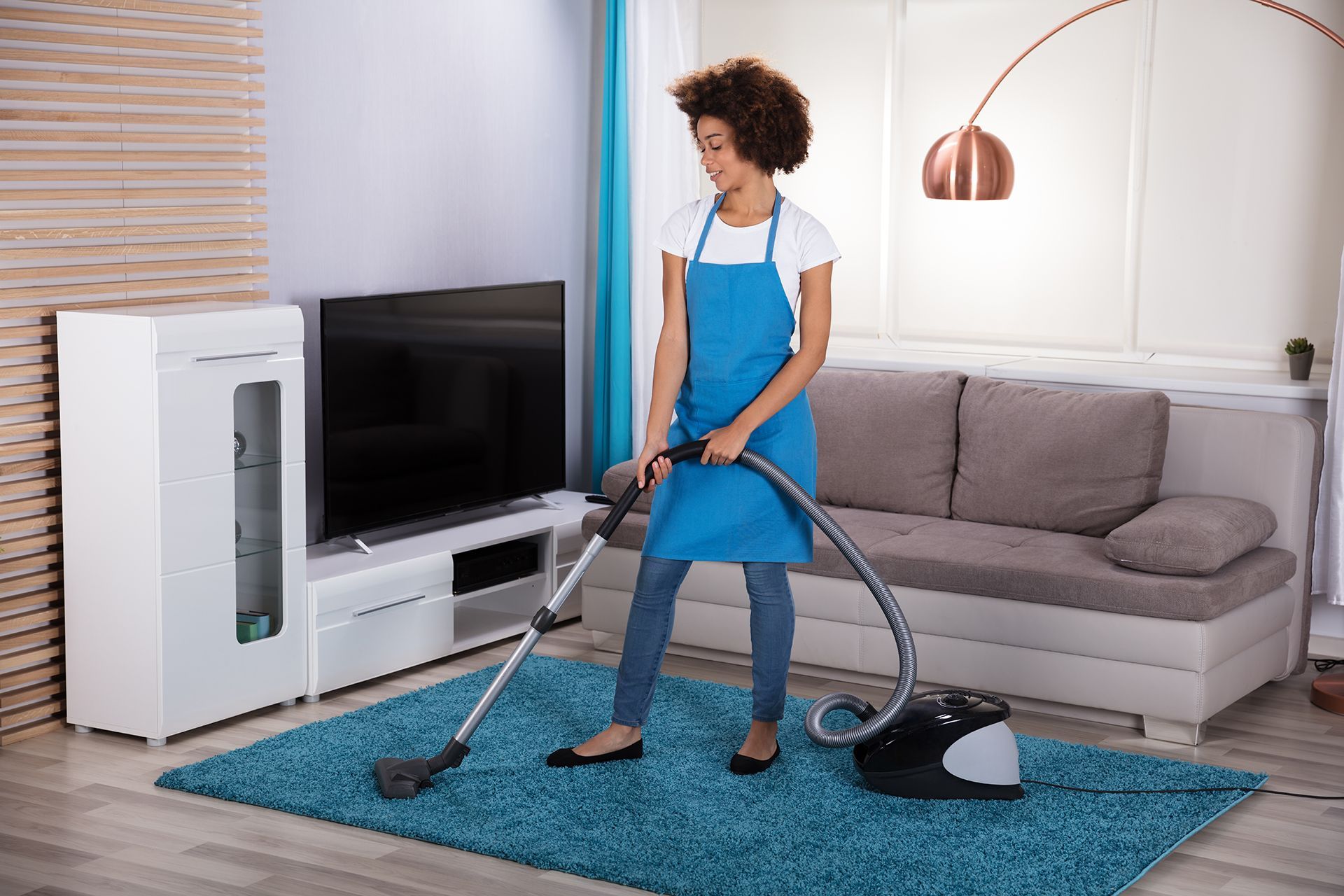 Maid Cleaning the House Rug