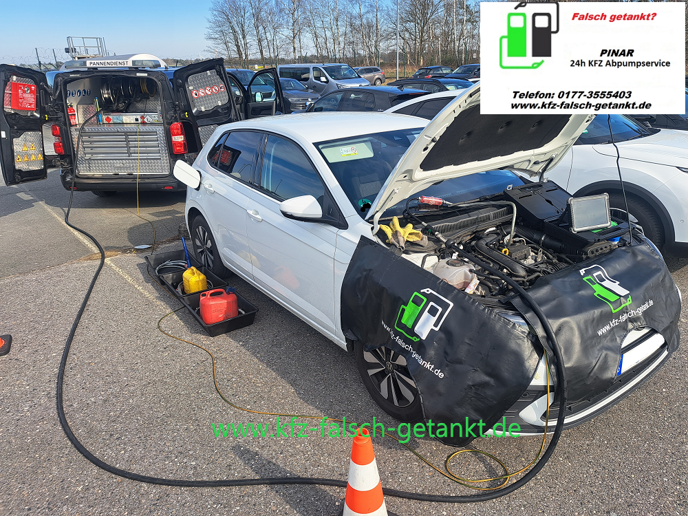 the wrong fuel is pumped out of a white car in a parking lot